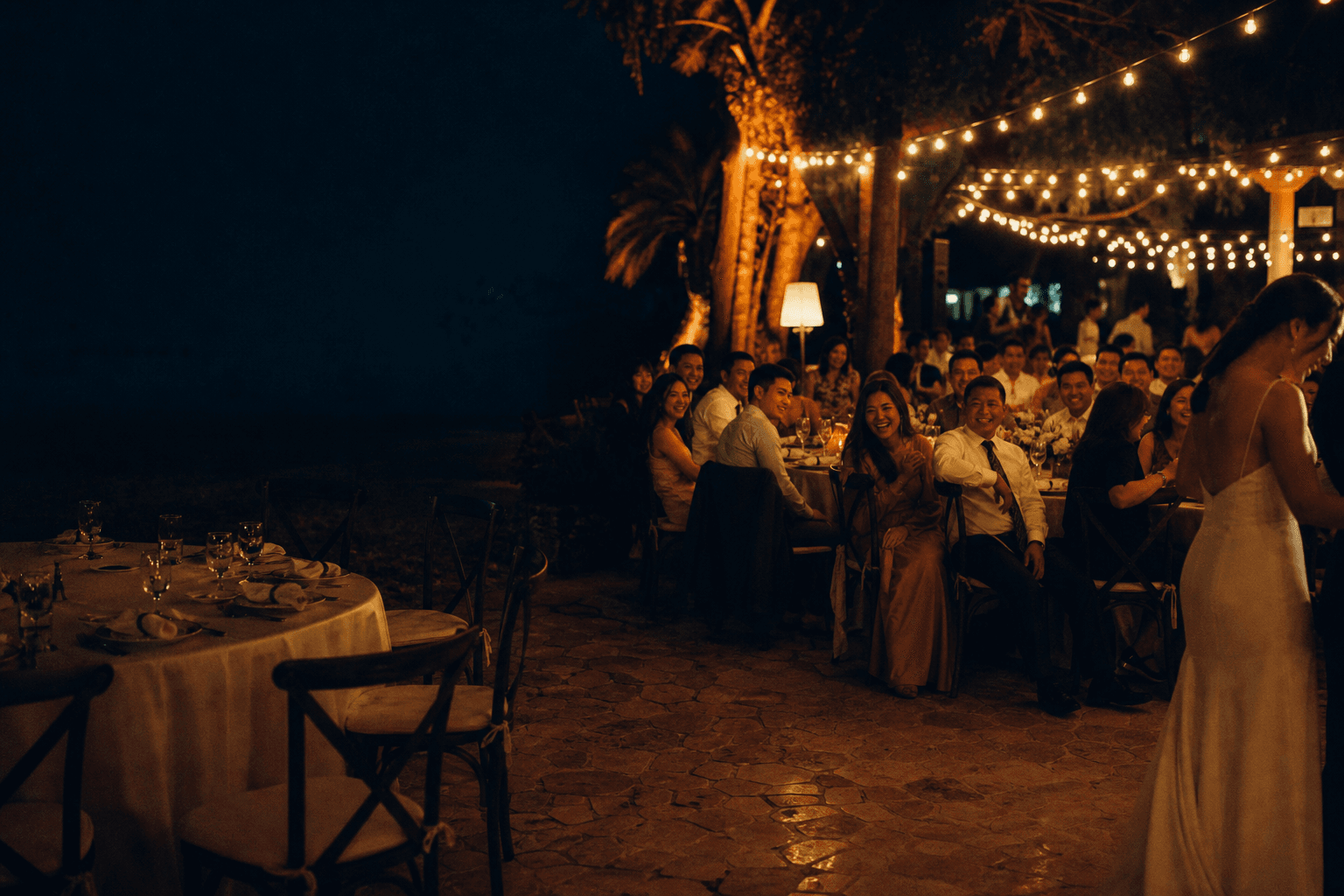 Guests sharing a candid laugh at a Filipino wedding reception